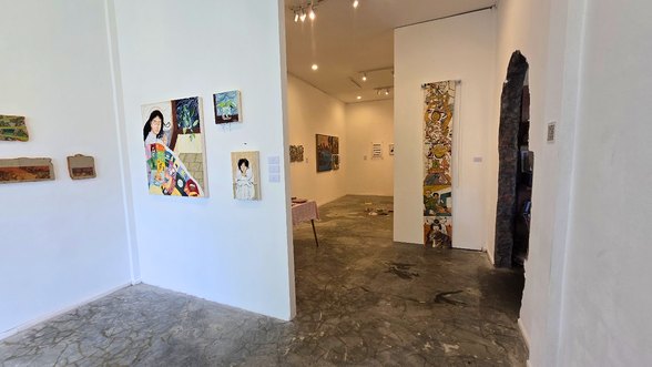 Gallery room at Purga ArtSpace with paintings on white walls